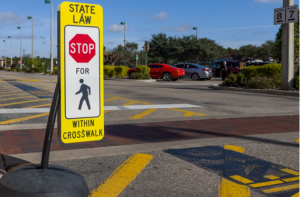 Stop sign at pedestrian crossing. 